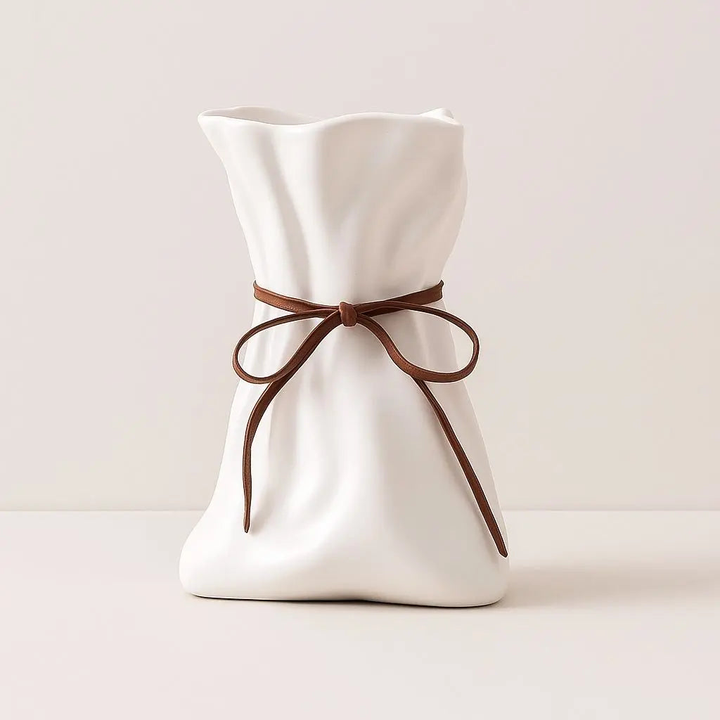 Modern ceramic vase with rope drawstring design for contemporary home decor and flower arrangements